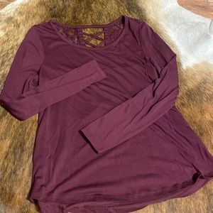Burgundy top with lace on top of back. Long sleeve